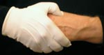 Hand wraps around hand to grip LI 4